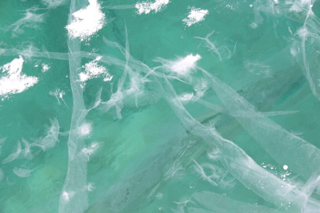 Green ice of the frozen Muncho Lake