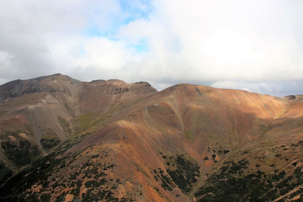 The soil on the slopes have red-tinted colours