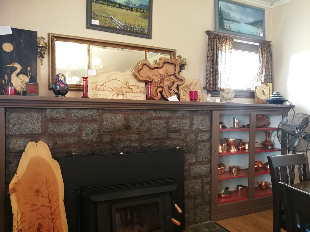 Wood carving and paintings decorated the mantel  and wall